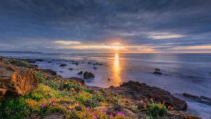 Long exposure seascape of Carrickalinga Beach at sunset, capturing smooth waves and warm twilight tones – landscape photography by Junrui Ye