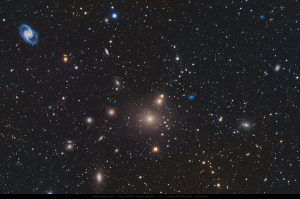 Fornax Galaxy Cluster featuring elliptical galaxy NGC 1399 surrounded by numerous faint members, captured through long-exposure deep sky astrophotography by Junrui Ye