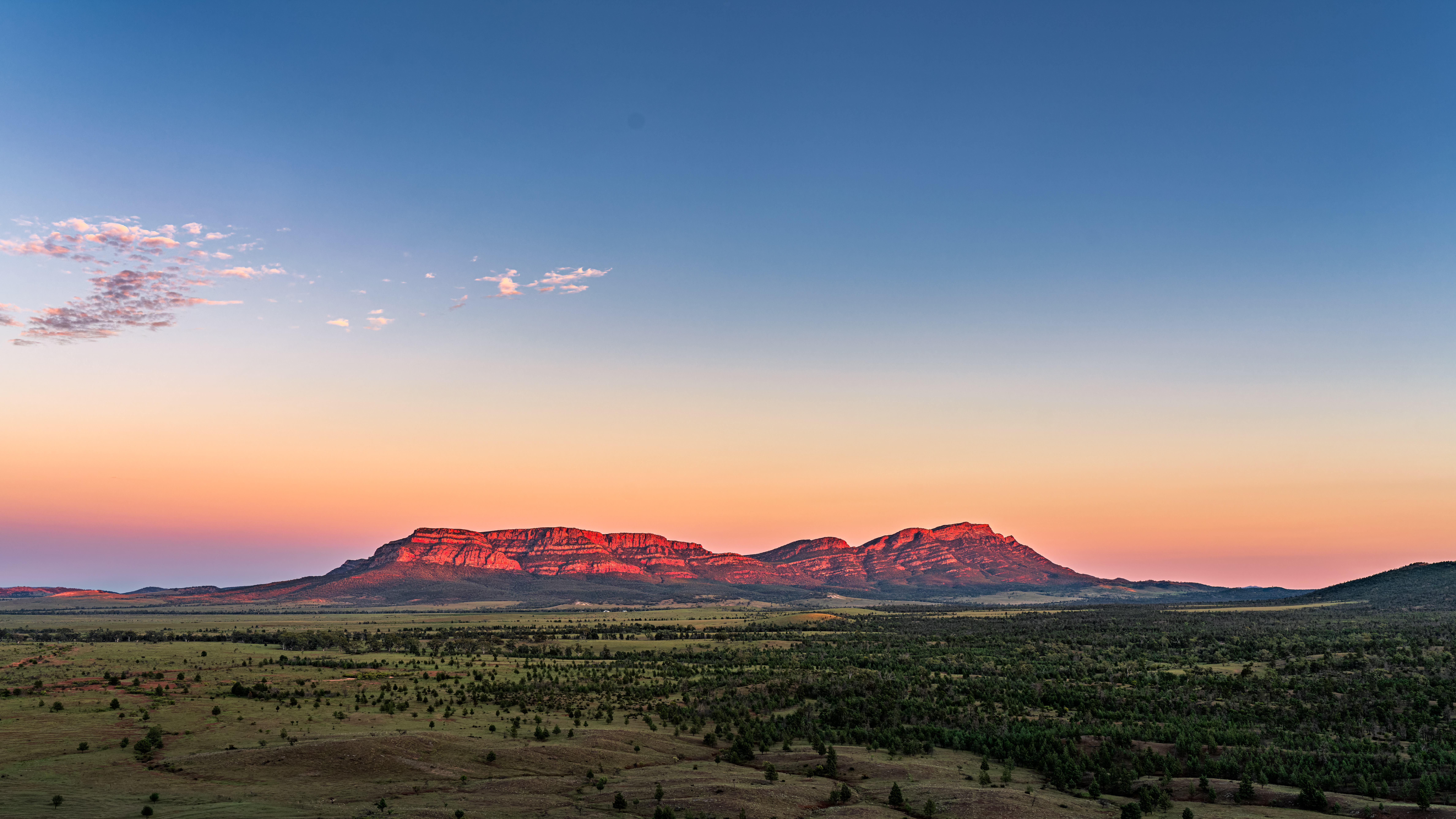 Wilpena Pound illuminated by the first light of sunrise, photographed from Pugilist Lookout in the Flinders Ranges – landscape photography by Junrui Ye