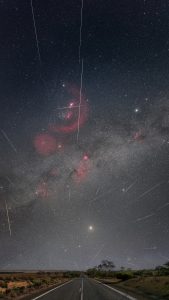 Geminids Meteor Shower Over the Milky Way, South Australia Geminids meteor shower streaks over the Milky Way above a straight outback road in South Australia, with Orion and red nebulae visible in the night sky