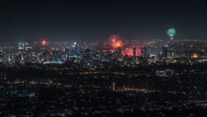 New Year’s Eve fireworks lighting up the Adelaide city skyline as seen from Mount Osmond Lookout, South Australia