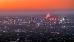 New Year’s Eve fireworks lighting up the Adelaide city skyline as seen from Mount Osmond Lookout, South Australia