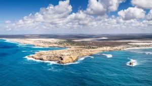 Fowlers Bay Scott Point Aerial View – South Australia Coastline Photography Aerial view of Scott Point at Fowlers Bay South Australia with rugged coastal cliffs, turquoise ocean and remote sandy coastline under scattered clouds