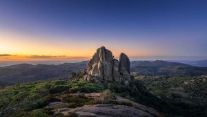 Sunset at The Cathedral Mount Buffalo – Alpine Landscape Photography Australia Sunset light on The Cathedral rock formation at Mount Buffalo National Park with warm tones over alpine mountains in Victoria Australia