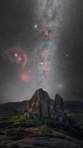 Milky Way above The Cathedral at Mount Buffalo National Park with visible nebula and granite rock formation in Victoria Australia night sky