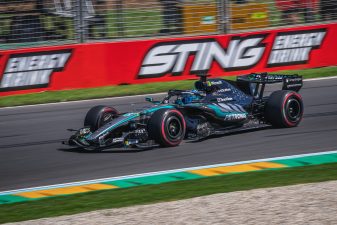 George Russell driving Mercedes Formula 1 car on racing circuit
