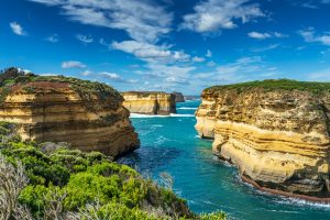 Narrow ocean inlet surrounded by limestone cliffs at Loch Ard Gorge in Australia