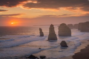 Golden sunset over the Twelve Apostles sea stacks on the Great Ocean Road in Victoria, Australia