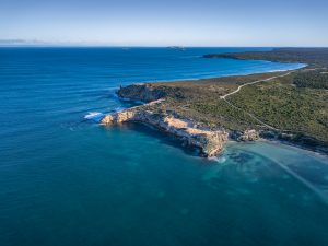 Aerial View of Ngarna – Rhino Head, Innes National Park Drone aerial view of Ngarna – Rhino Head, featuring rugged limestone cliffs, turquoise waters and the pristine coastline of Innes National Park, Yorke Peninsula, South Australia.