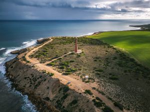 Aerial View of Troubridge Point Lighthouse, Yorke Peninsula Drone aerial view of Troubridge Point Lighthouse overlooking the rugged coastline of Yorke Peninsula, South Australia, beneath dramatic storm clouds.