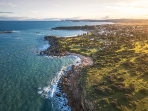 Aerial view of Ratalang (Basham Beach) Conservation Reserve and the Port Elliot coastline at sunset, South Australia