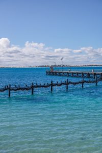 Point Sinclair Jetty with seabirds perched above the turquoise coastal waters of South Australia